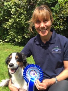 Dog and person with award